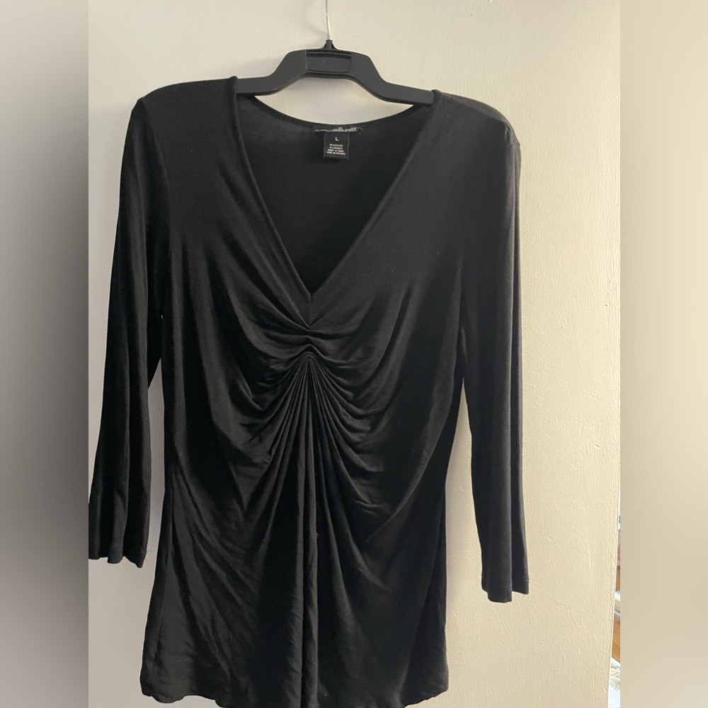 Women’s long sleeved black pleated shirt. Size L.